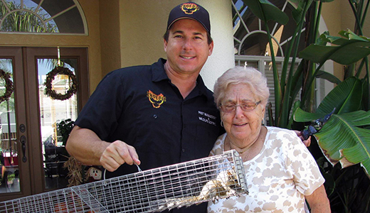 Scared Grandma Posing With Riverview Pest Control Man Who Removed Wildlife From Her House