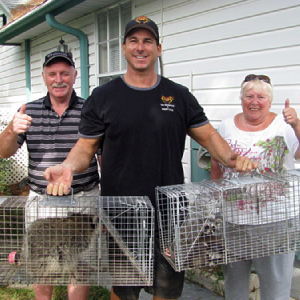 Pest Control Expert Posing with a Couple From Their New Service Area in Citrus County FL